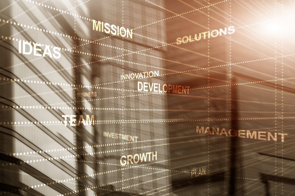 Abstract background with words "Mission", "Ideas", "Solutions", representing business concepts.