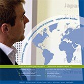 A profile view of a man in a suit looking at a world map on a presentation or poster. The image includes text related to global organization and strategies.