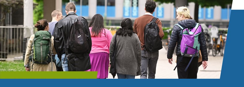 IMPRS-SPCE, Alumni A group of eight people walking away, wearing backpacks. They are outdoors, with greenery and a building in the background.